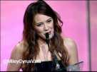 Hilary Duff presents Miley with a Global Action Award